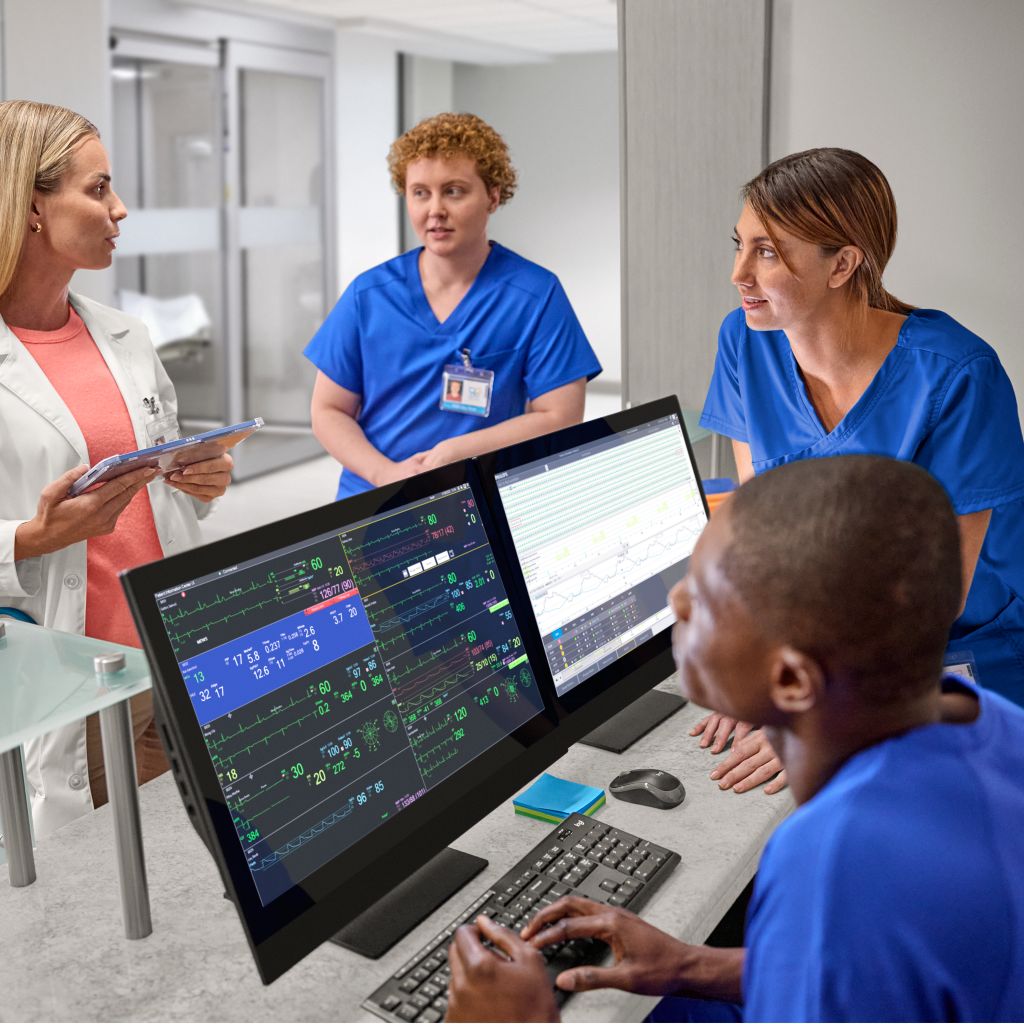 Clinicians using PIC iX central station monitoring to oversee patients
