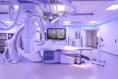 Philips Azurion interventional suite with FlexVision Connect display showing calming imagery