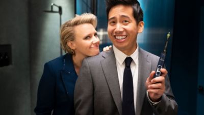 Actor holding Philips Sonicare DiamondClean Smart toothbrush in campaign scene