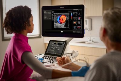 Sonographer taking a scan of patient