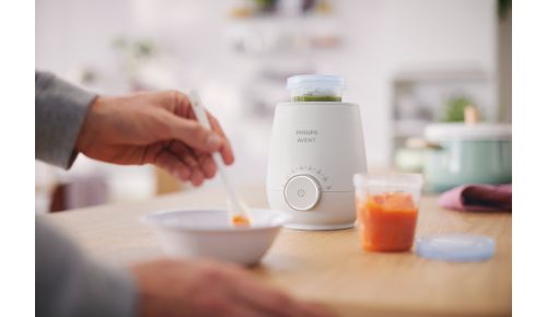 Wärmt Behälter mit Babynahrung und Milch auf