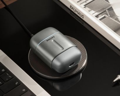 Compact Philips 700 shaver on Wireless Qi-charging compatible pad