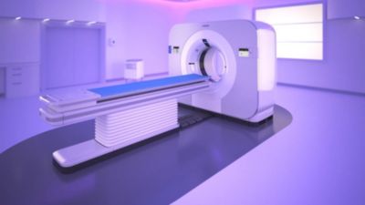 Scanner CT spettrale Philips in una sala con illuminazione ambientale viola.