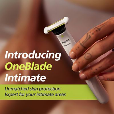 Hand holding Philips OneBlade Intimate