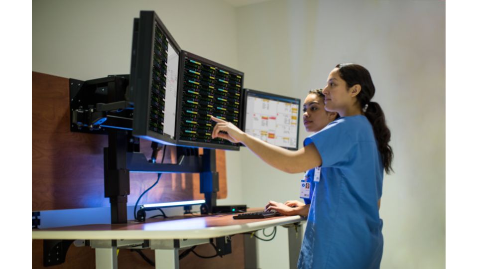 Clinicians looking at monitors