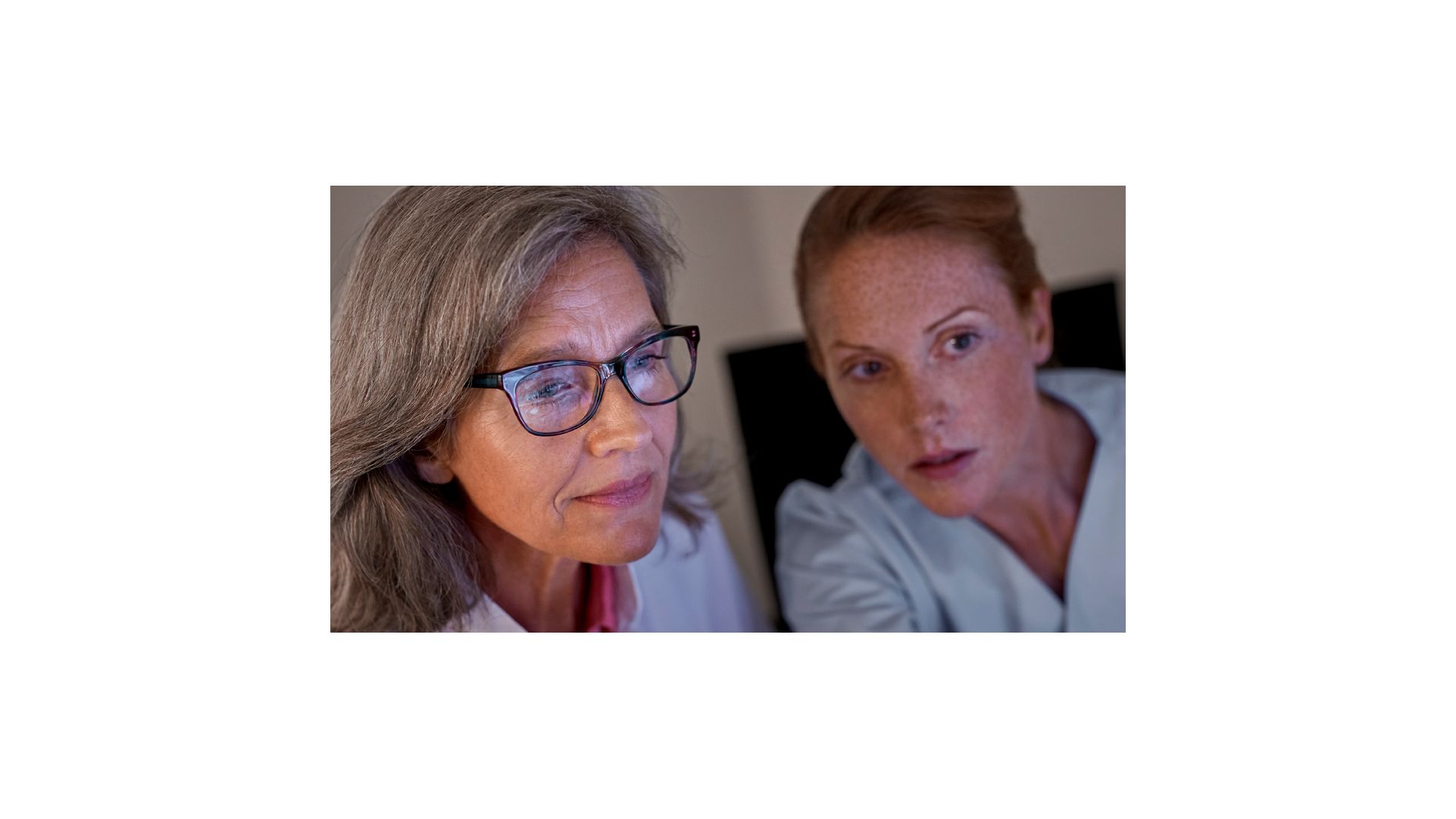 female techs looking at screen