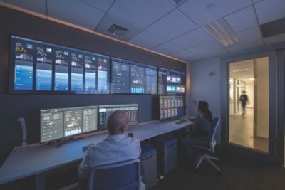 Two men watching screens in the operation command center