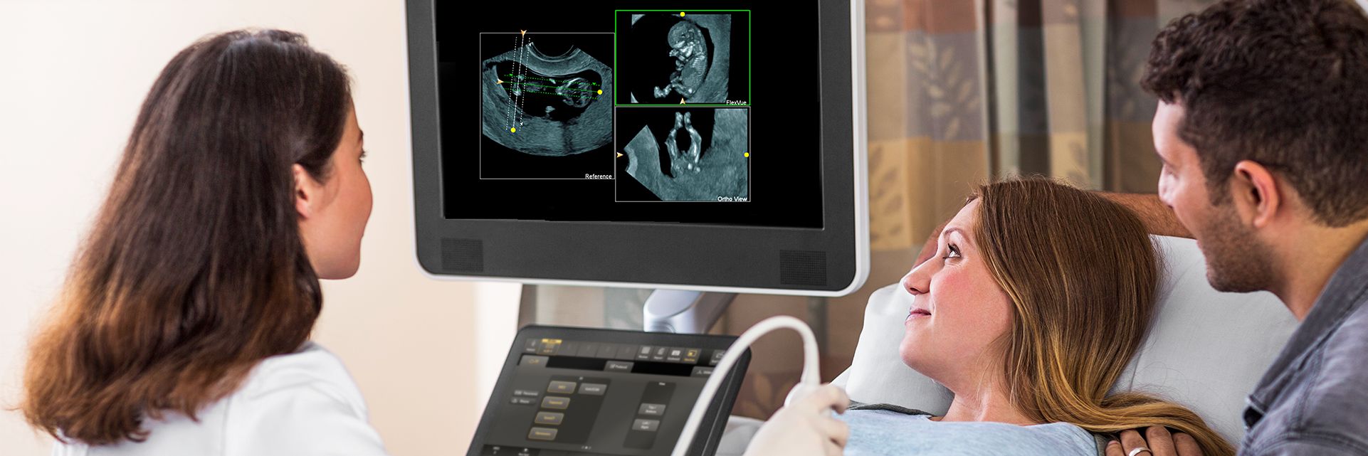 Woman receiving fetal ultrasound exam using FlexVue and Orthogonal View
