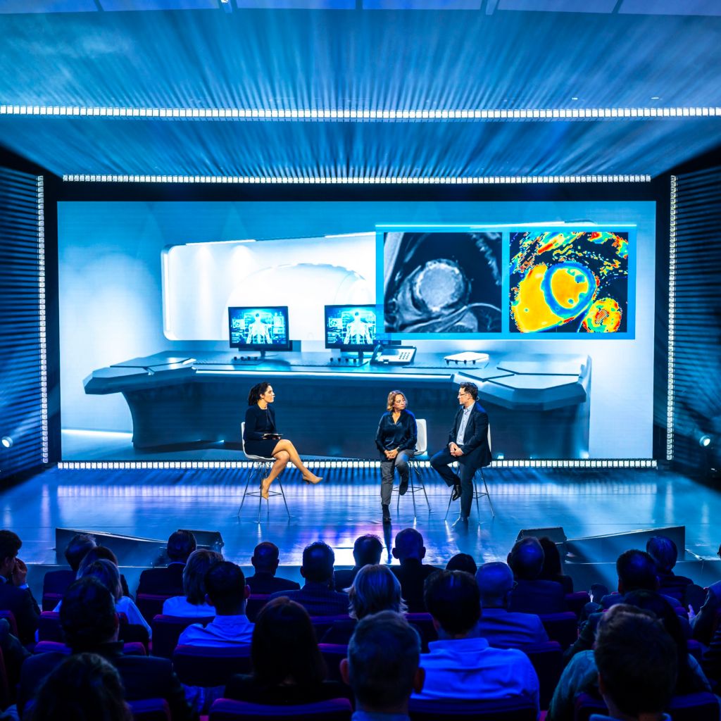 Customers on stage with Nadine Reijnders talking about the BlueSeal solution
