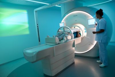 Patient undergoing MRI scan in modern imaging suite
