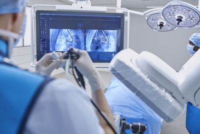 Clinician performing image-guided procedure using Philips Azurion interventional suite