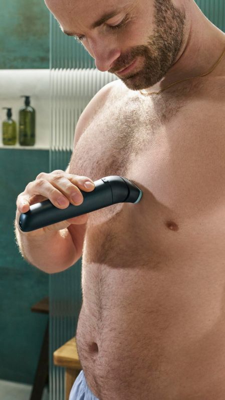 Man shaving chest with Body Groomer 7000