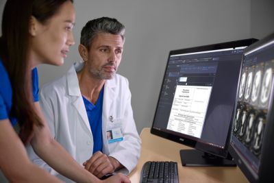 Healthcare professionals reviewing patient records and diagnostic images using Philips Enterprise Imaging