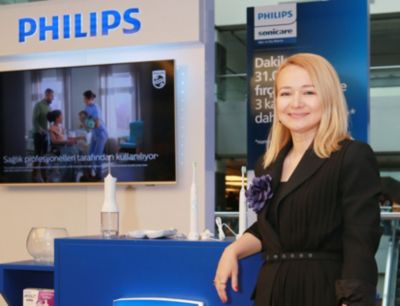 Sibel Yildiz at conference booth