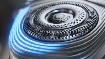 Primer plano de una cuchilla girat&oacute;rio da una afeitadora rotativa Philips.