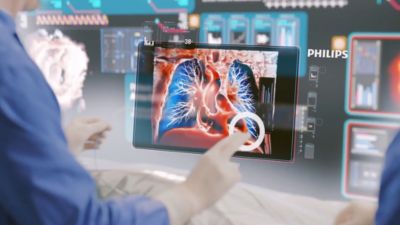 A medical professional interacting with lung imaging during image-guided intervention