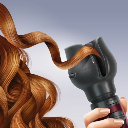 Style bouclé ou lisse avec le boucleur soufflant