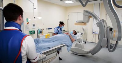 Clinical team with patient in hospital