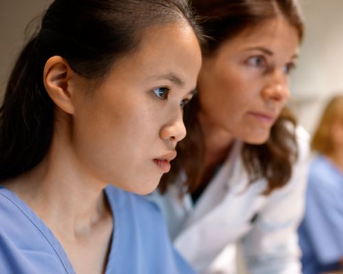 Tech and radiologist looking at screen