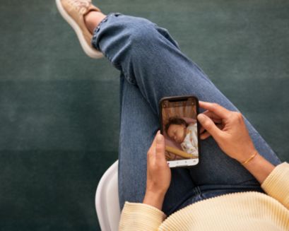 Mom watching the baby via phone