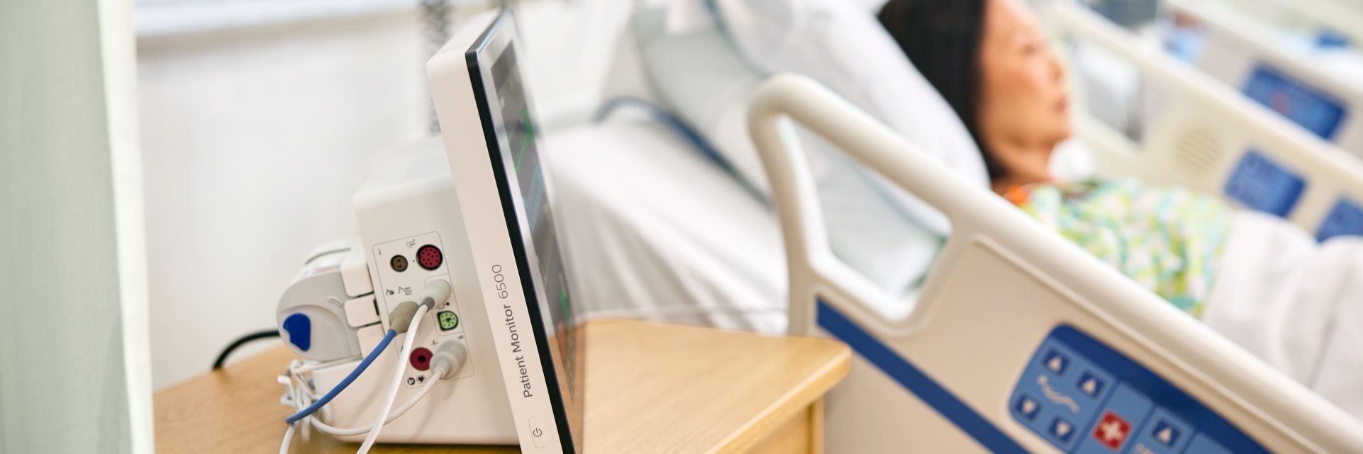 Woman being monitored by patient monitor 6000 series