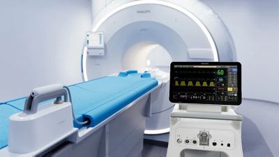 Philips MR400 MRI scanner with patient table and monitoring equipment in imaging room