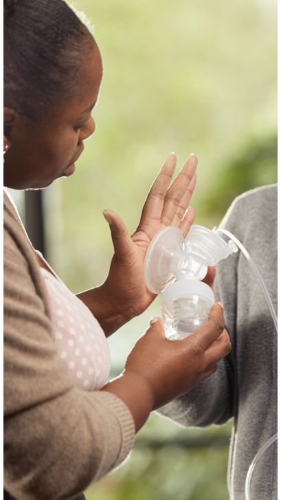 Woman holding a breast pump