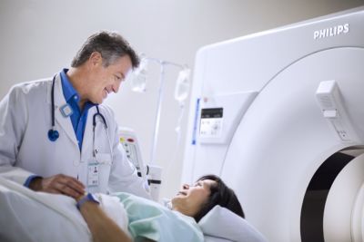 Clinician comforting patient on a Philips CT imaging system