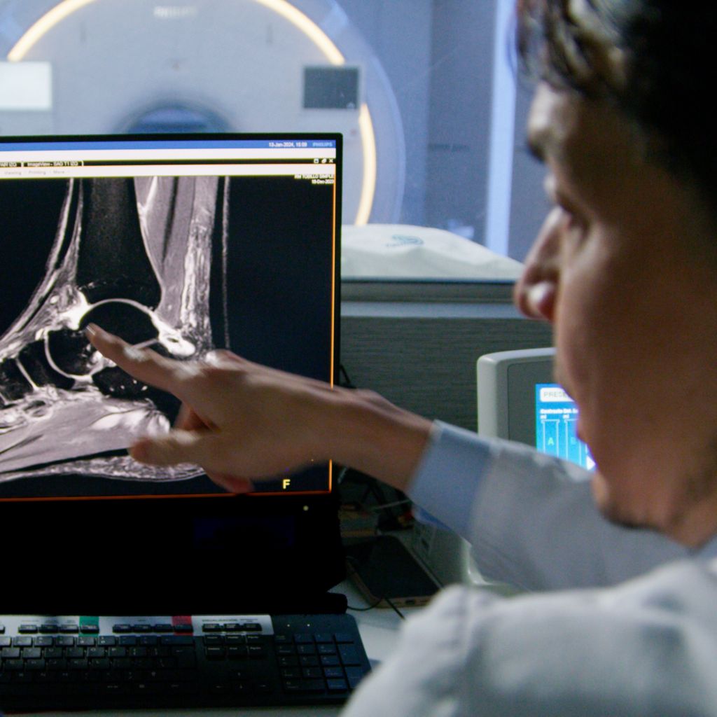 Dr. Eduardo Onodera Chief of Radiology Pacifica Salud Costa del Este Panama looking at WorkSpace screen of a foot image