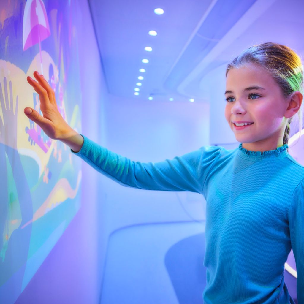 Girl playing with Minnie Mickey Disney theme for Ambient Experience for MR