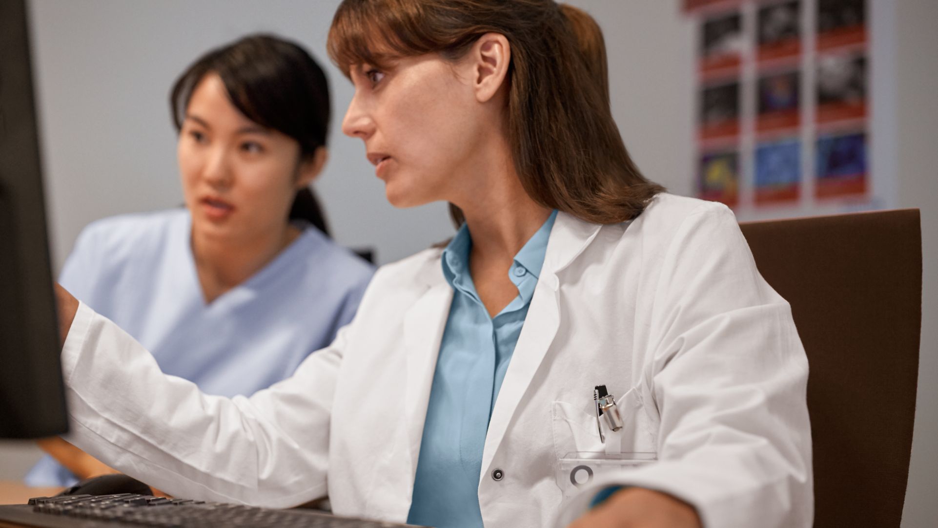 Doctors working on computer