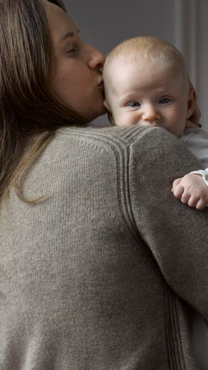 mom holding baby