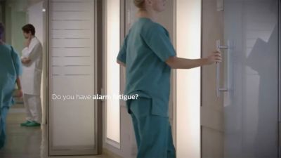 Clinicians monitoring patients in ICU while managing multiple clinical alarms
