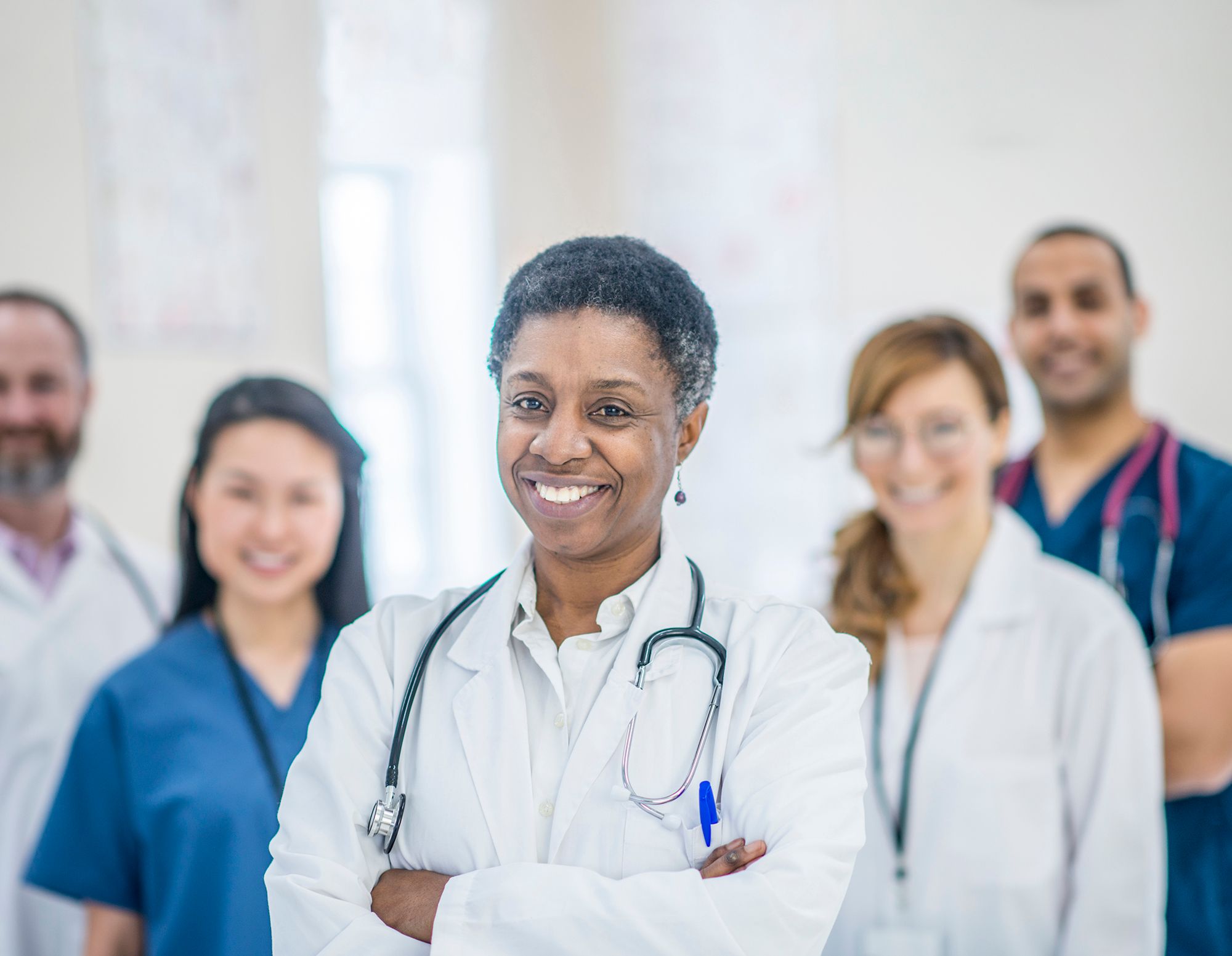 Group of healthcare professionals standing together in a clinical setting