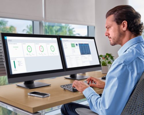 Clinician reviewing MDIP Dashboard and Neuron CX