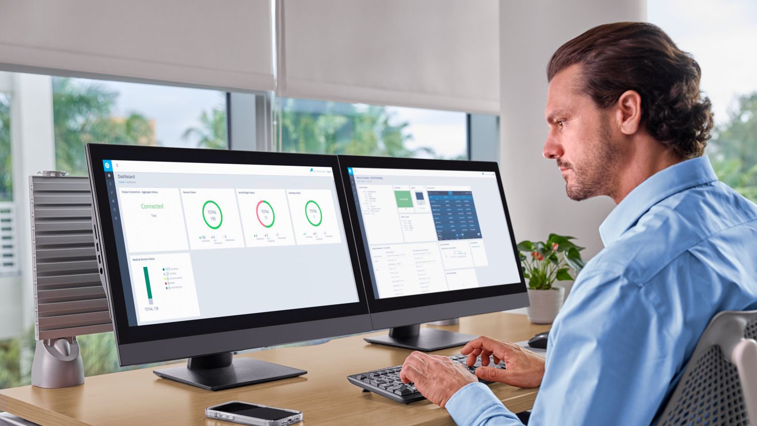 Clinician reviewing MDIP Dashboard and Neuron CX
