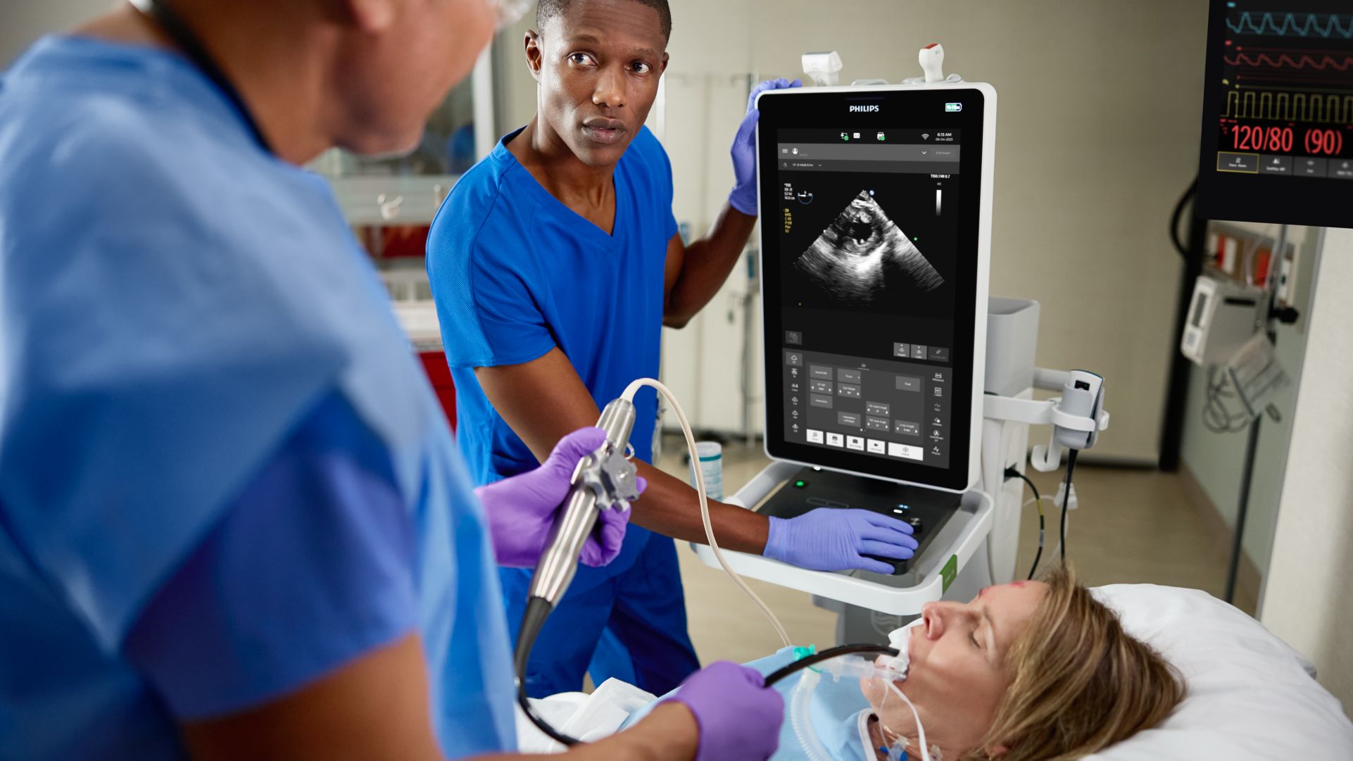 POC clinician performing TEE scan on adult patient.