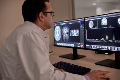 Doctor reviewing multi nuclei images on screen
