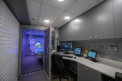 Interior view of Philips mobile MRI unit showing control room and scanner area