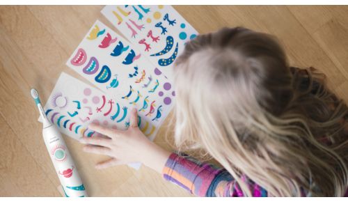 Fun stickers help kids turn their toothbrush into a friend