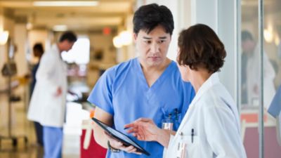 Doctor and nurse discussing patient care