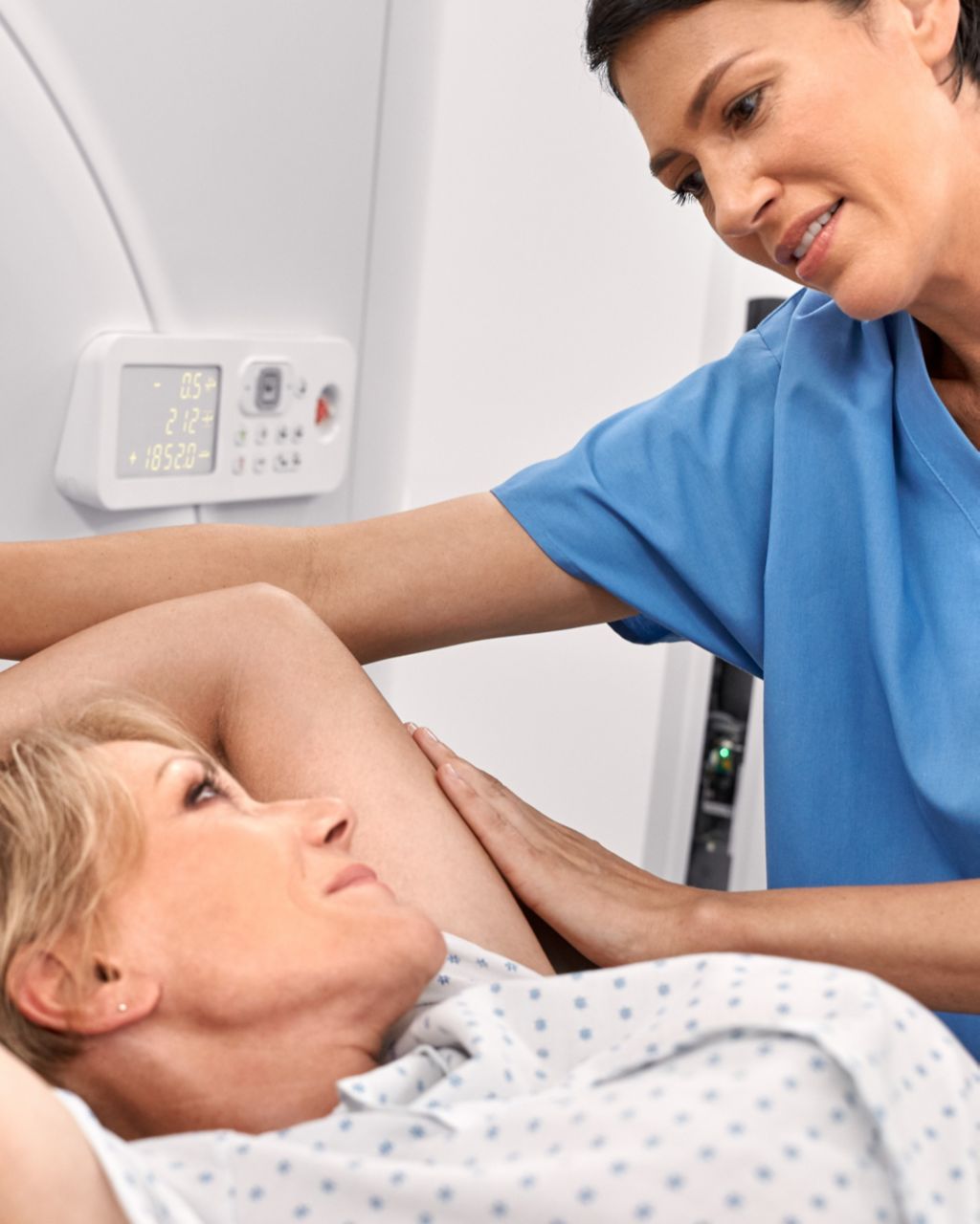 tech and patient in ct simulator