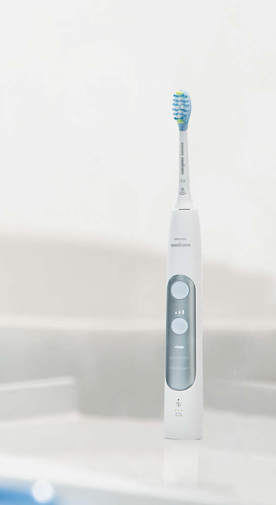 Philips ExpertClean power toothbrush standing on a shelf