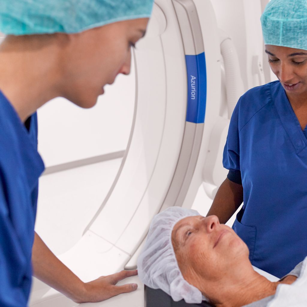 Clinicians in the exam room performing a PCI procedure using Azurion with ClarityIQ