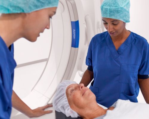Clinicians in the exam room performing a PCI procedure using Azurion with ClarityIQ