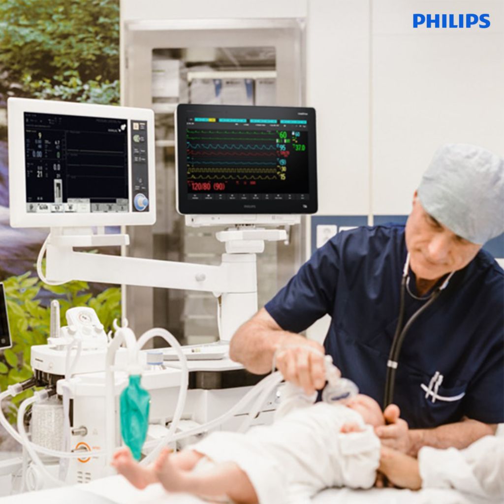 Getinge Philips OR Anesthesia partnership, Anesthesiologist with infant patient in OR