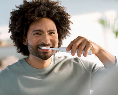 Man brushing with a Sonicare 2300 power toothbrush