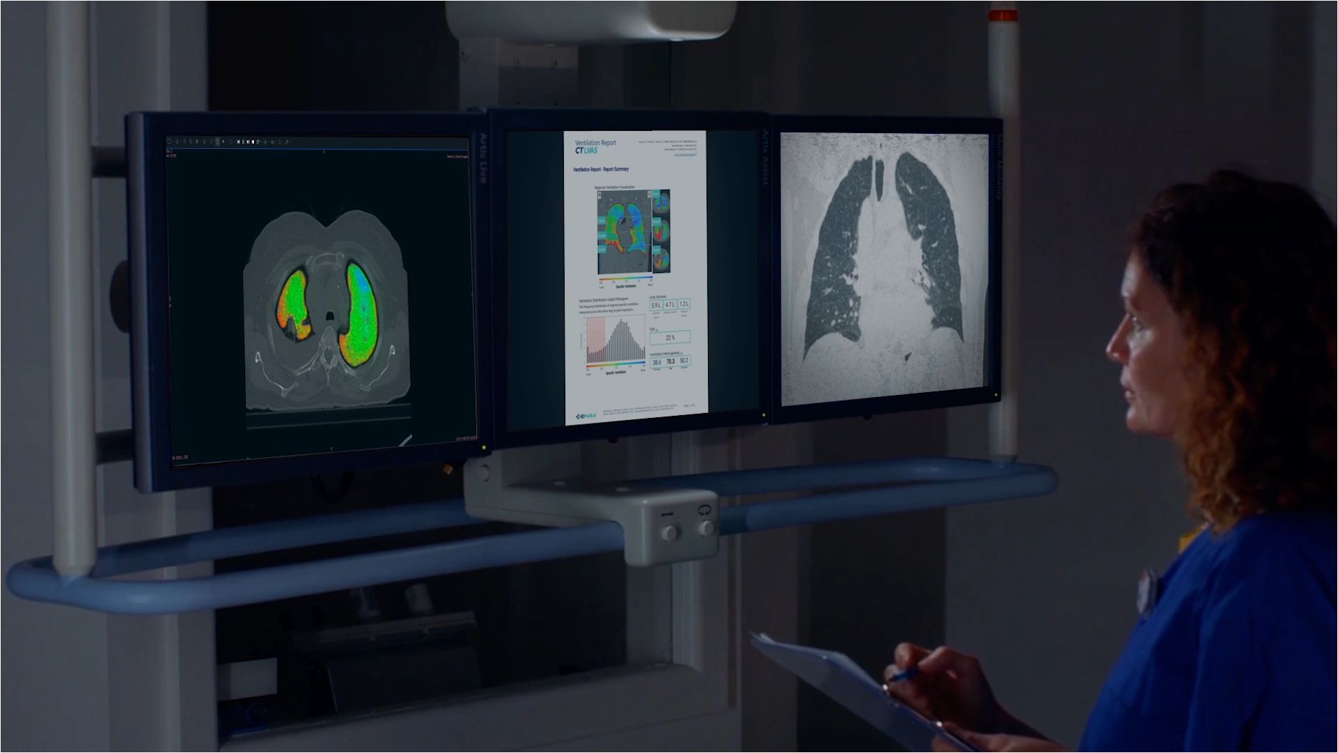 Healthcare professional looking at monitors showing lungs