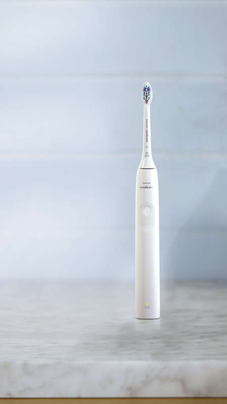 Philips Sonicare 2300 power toothbrush standing on a countertop