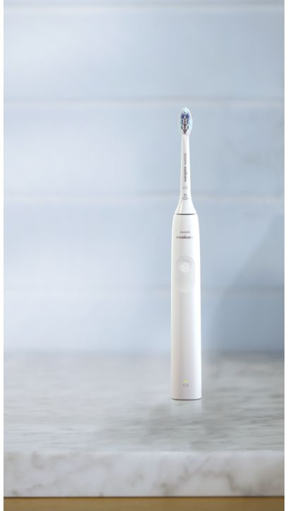 Philips Sonicare 2300 power toothbrush standing on a countertop